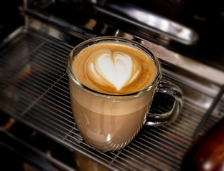 Coffe cup with latte milk coffee in cafe closeup