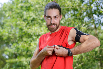 Fototapeta premium man fastening his smart watch heart rate monitor