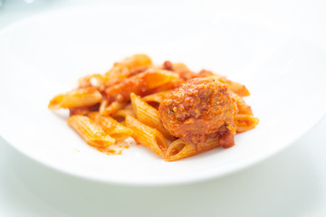 Italian pasta with tomato sauce and meatballs