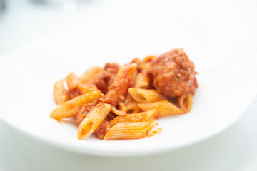 Italian pasta with tomato sauce and meatballs