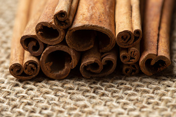 cinnamon sticks on burlap background