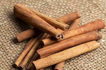 cinnamon sticks on burlap background