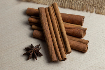 cinnamon sticks and star anise on wooden background