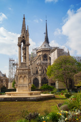 Fototapeta na wymiar Vierge fountain in garden of Jean XXIII at Notre Dame de Paris, France