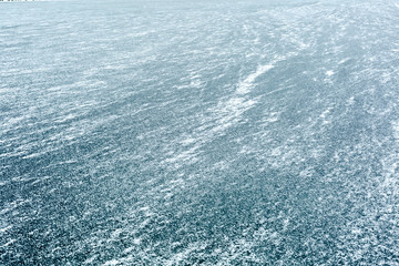 Fototapeta na wymiar Frozen blue lake in winter. View from above