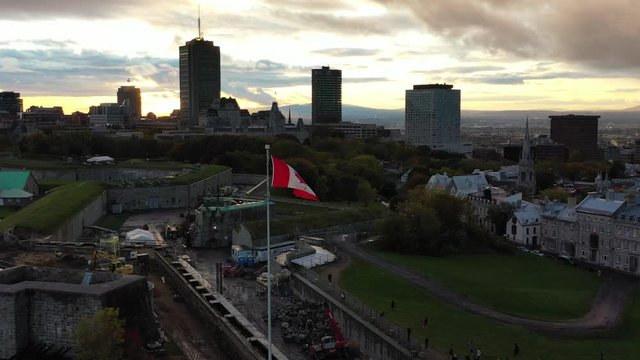 Aerial view of Quebec City and Citadel at sunset with Canadian flag