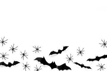 Stylish Halloween design. Bats and spiders on white background top view space for text frame