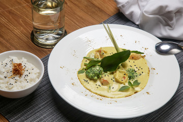 Seafood curry. Exquisite dish. Creative restaurant meal. Fine dining concept.	