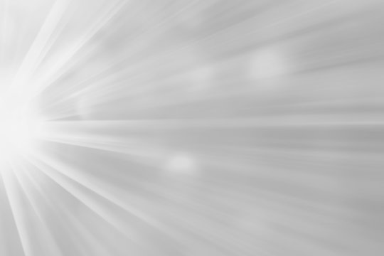 Abstract white gray blurred radiant sunrise banner background