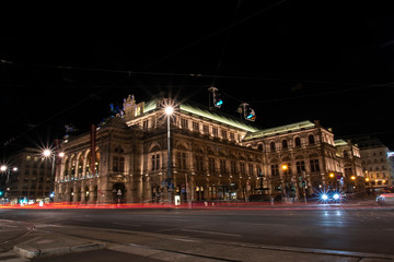 Fototapeta na wymiar Vienna Opera House at Night, Traffic passing by 02