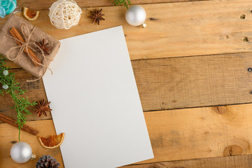 Christmas wooden ventilation background with empty postcard, layout for design and gifts, Christmas tree and cinnamon. Background for greeting card or Happy New Year
