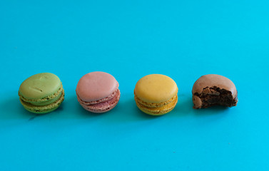 sequence of macarons with the last one bitten