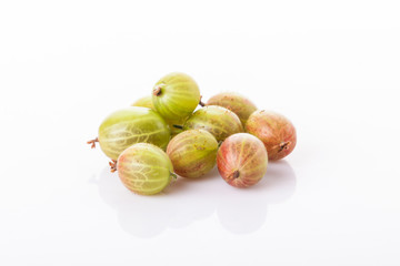 heap of green gooseberries isolated on white background