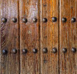 Old wooden door with bolt detail for background