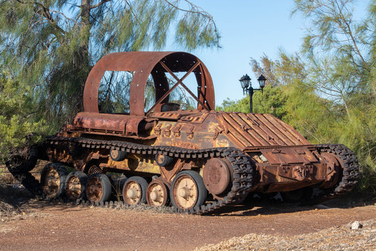 Rusty vehicle on tracks