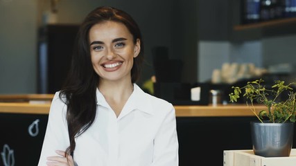 beautiful woman in formal clothes smiling with restaurant background