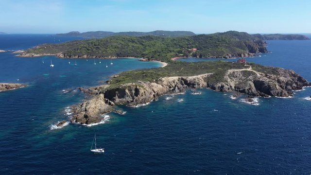 Pointe Sainte Anne Langoustier beach aerial view with a sailing boat along the coast Porquerolles France