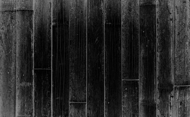 Rustic black and white vintage textured wood bamboo background with rough grain. Vertical parallel boards.