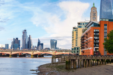 Obraz premium London at sunset with riverside buildings, Blackfriars Bridge and the City