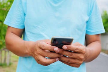 Man is using mobile phone.