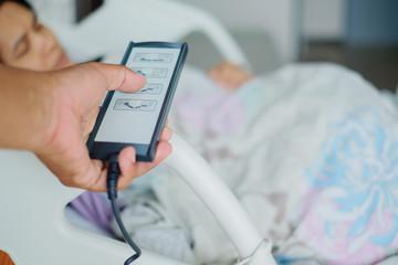 remote control to adjust the level of the hospital bed.