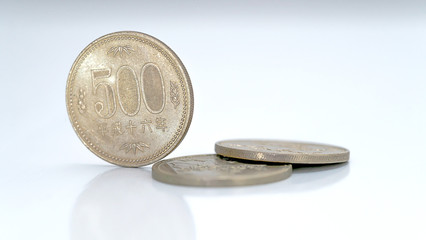 Closeup of Japanese yen money coins on isolated white background for financial concept
