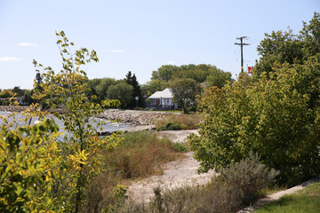 Gmili, Manitoba/Canada - September 9, 2019: Lake houses framed by green vegetation.