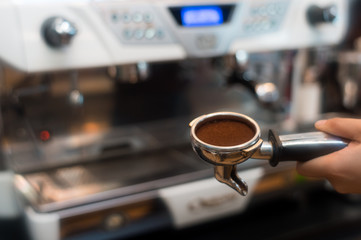 Coffee powder on coffee tamper