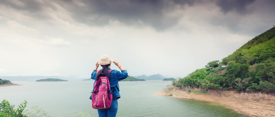 Happy young asian girl at Kang Kra Chan National Park Thailand