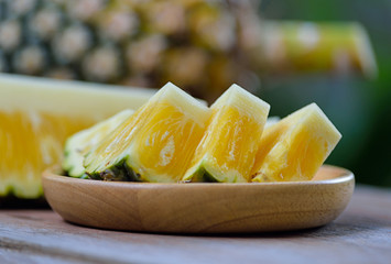 Fresh pineapple on wooden background.