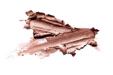 Smear of gold matte creamy eye shadow or metallic lipstick isolated on white background luxury make...
