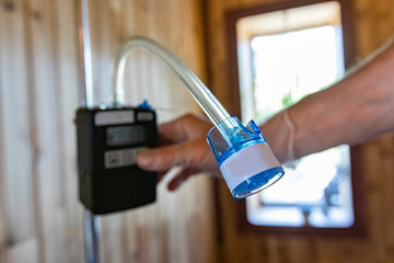 Indoor damp & air quality (IAQ) testing. A close up view of a spore trap, used by a building...