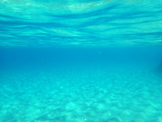 Looking at Seabed and water surface from underwater