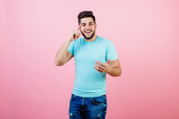happy handsome smiling man thinking having idea isolated over pink