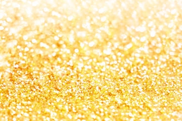Gold bokeh texture. Festive glitter background with defocused lights
