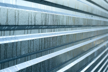 Obraz premium wet metal board for copy space,metal ribbed silver background