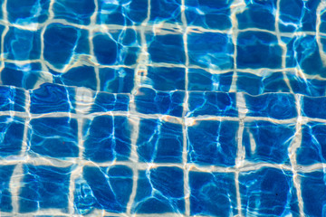 Blue color water in swimming pool rippled