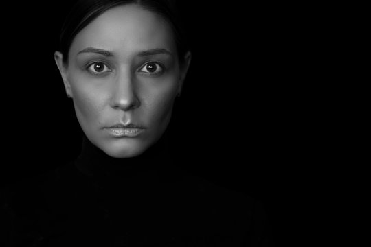 Portrait of a woman black and white photo, a woman in black clothes, hair styled, no makeup