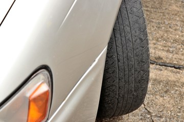 Worn out tyre concept. Danger of using a worn out tyre with very little tread remaining.