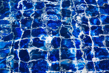 Blue color water in swimming pool rippled
