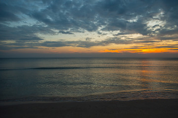 Naklejka na ściany i meble Siluette sunset at the beach background