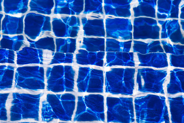 Blue color water in swimming pool rippled