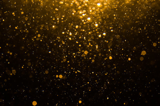 Abstract gold bokeh with black