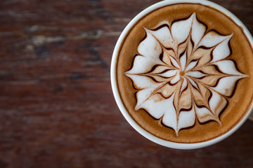 Cup of coffee with  latte art on top