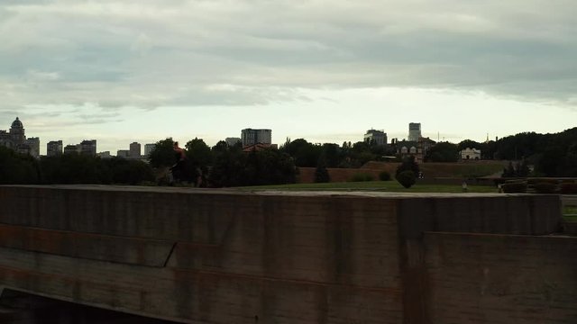 Kiev, Ukraine-August 2019: a young man runs on the roof and does a backflip