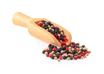 Tri colors peppercorns  in wooden spoon on white background