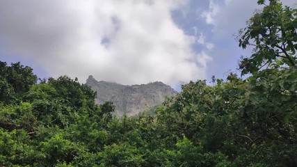 View of the girnar mountain covered by clouds as seen from Jatashankar in Junagadh, Gujarat, India
