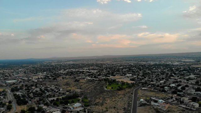 Drone flying toward the west side of Albuquerque, New Mexico. Flying towards and over Pat Hurley Park.