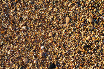 sea pebbles colored granite on the beach