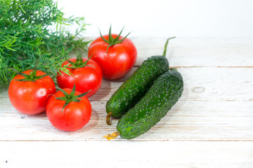 Harvest. Red tomatoes with a green stem. Space for your text.